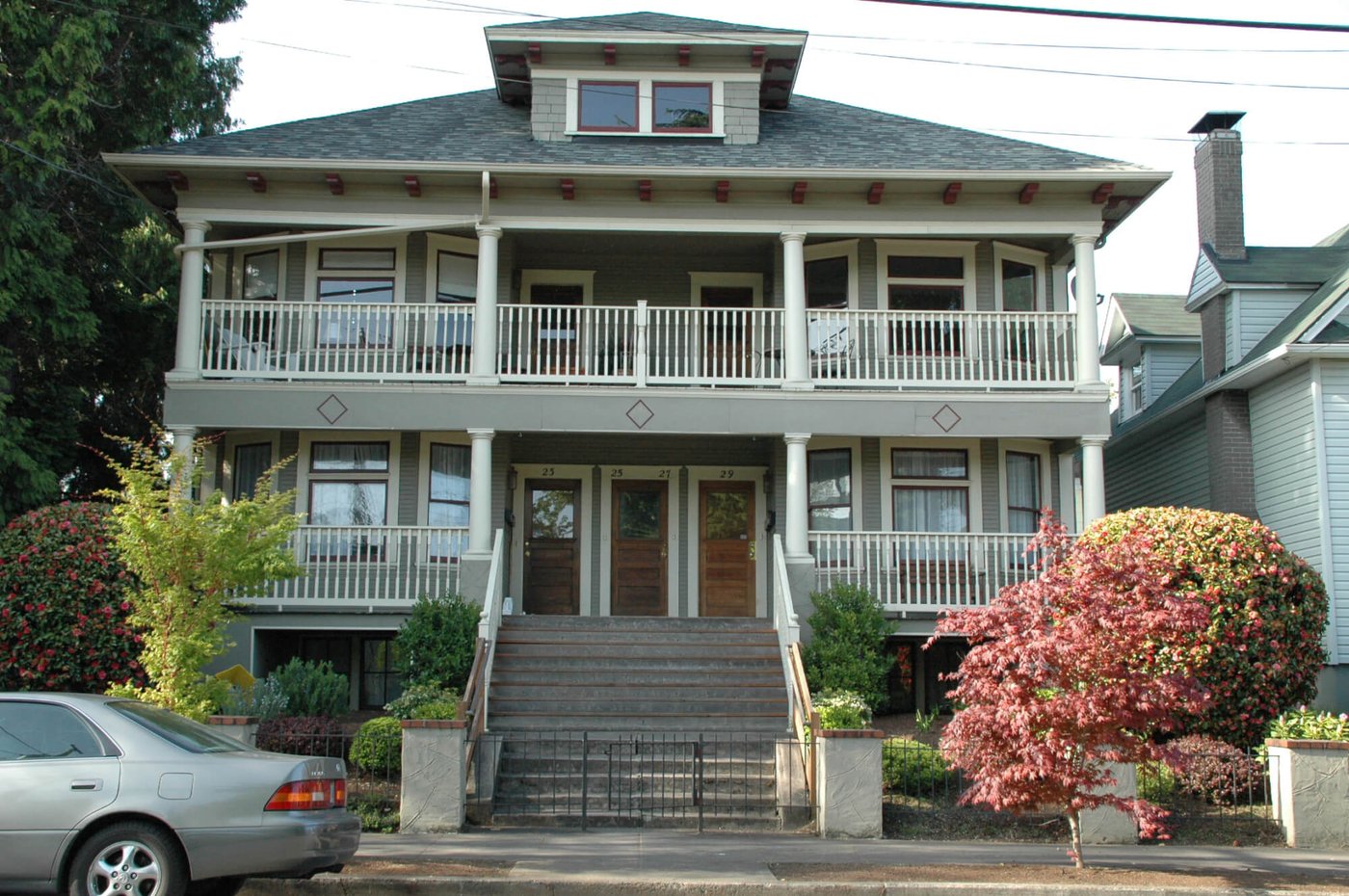 Two-story multi-unit residential investment property — duplex, triplex, or fourplex exterior